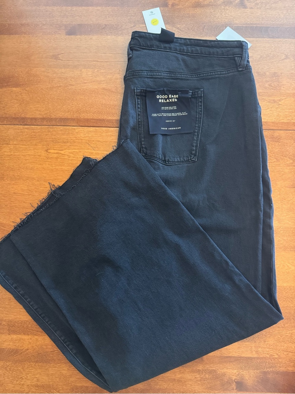 Good American Black Flare Jeans with Raw Hem